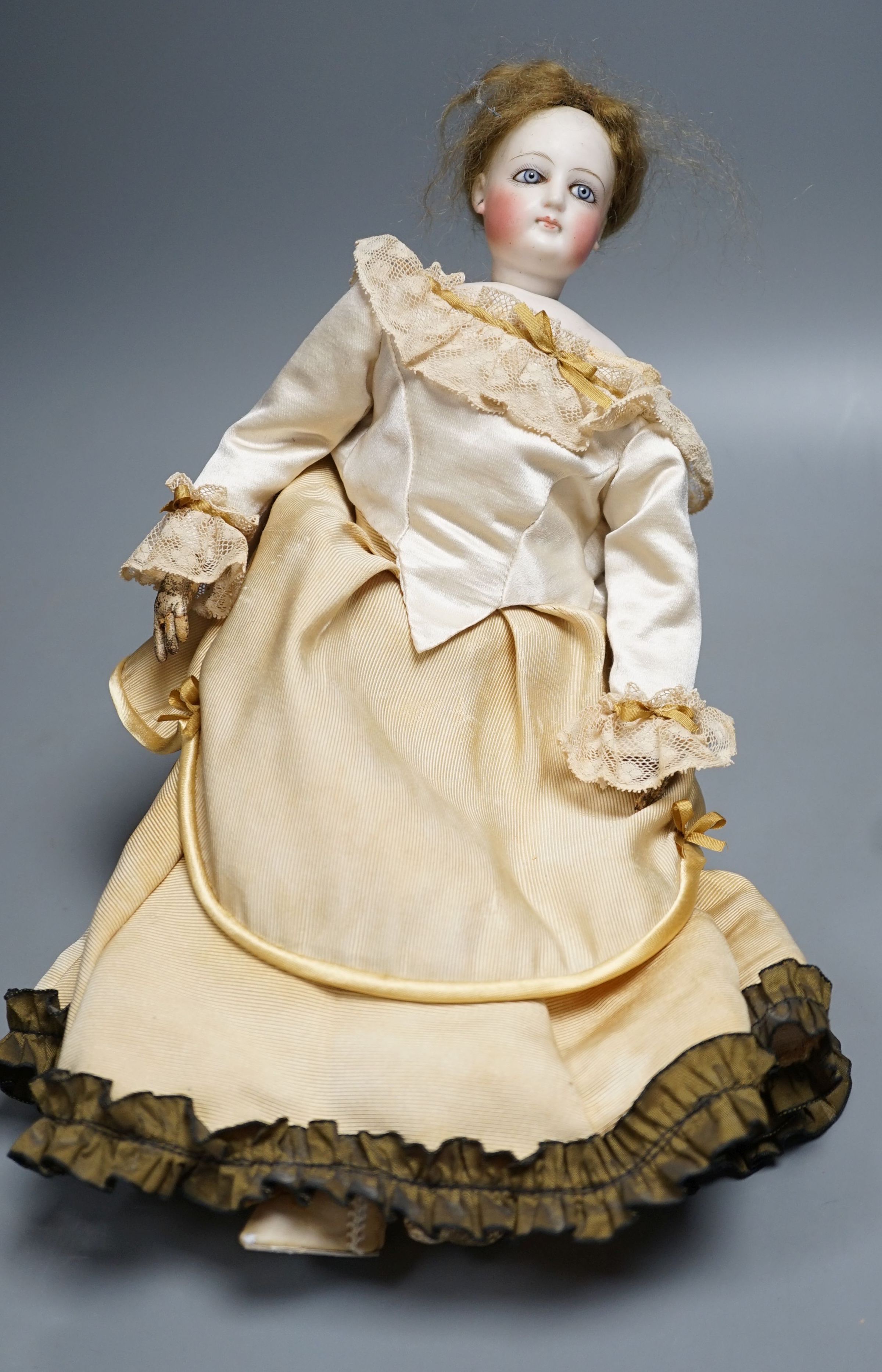 An S.G. bisque shoulder head French fashion doll c.1875, 36cm.